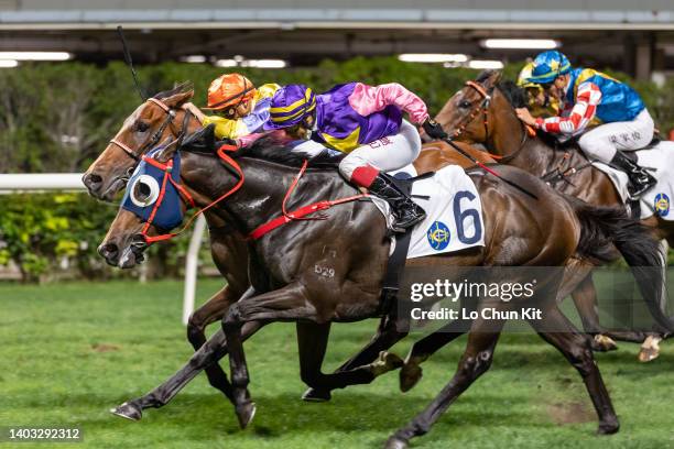 Jockey Alexis Badel riding Everyone's Delight wins the Race 3 Castle Peak Bay Handicap at Happy Valley Racecourse on May 25, 2022 in Hong Kong.