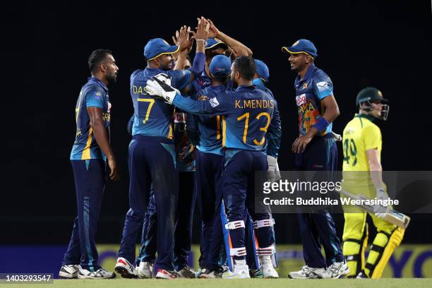 Chamika Karunaratne of Sri Lanka celebrates with teammates after dismissing Steven Smith of Australia during the 2nd match in the ODI series between...
