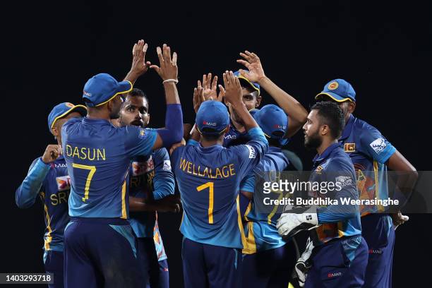 Chamika Karunaratne of Sri Lanka celebrates with teammates after dismissing Steven Smith of Australia during the 2nd match in the ODI series between...