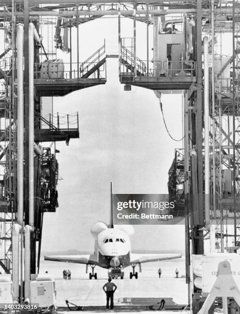 Space shuttle Enterprise Orbiter is towed back to the gantry where it will resume its perch atop a 747 after successfully completing its first "free...