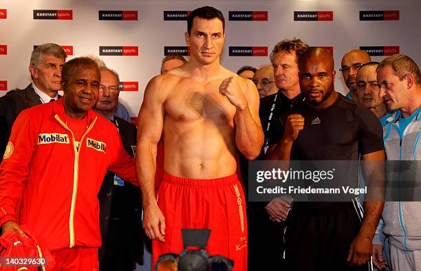 Wladimir Klitschko of Ukraine and Jean-Marc Mormeck of France pose during the weigh in for their IBO, WBO, WBA and IBF heavy weight title fight at...