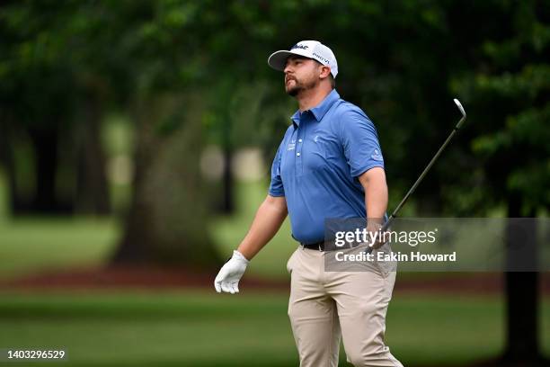 Brett White watchess his second shot of the first hole during the third round of the BMW Charity Pro-Am at Thornblade Club on June 11, 2022 in Greer,...