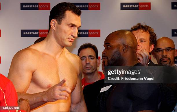 Wladimir Klitschko of Ukraine and Jean-Marc Mormeck of France come face to face during the weigh in for their IBO, WBO, WBA and IBF heavy weight...