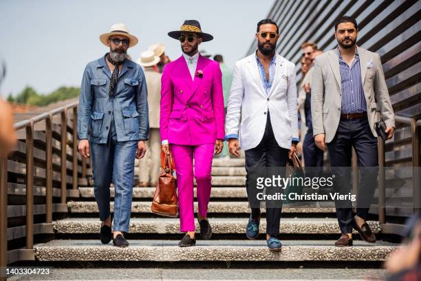 Guests seen wearing suits, jackets, blazer, hat, loafers, bag at the Pitti Immagine Uomo 102 at Fortezza Da Basso on June 16, 2022 in Florence, Italy.