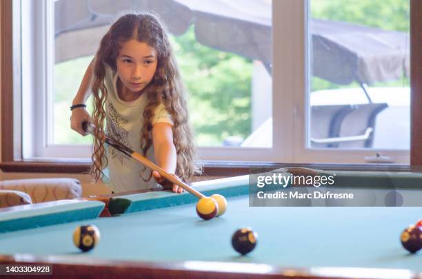 teenage girl playing pool - playing pool stock pictures, royalty-free photos & images