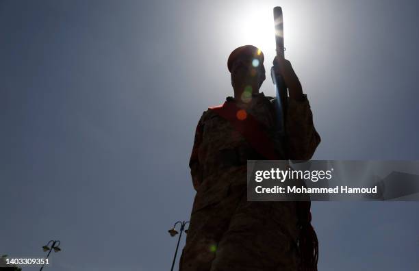 Member of the music band plays during a funeral of Houthi fighters killed in previous battles between the Iran-allied Houthi movement against forces...