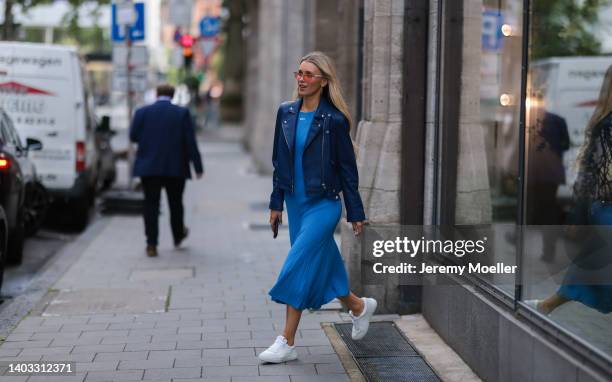 Scarlett Gartmann-Reus seen wearing a red sunglasses, a blue midi dress from Off White, a blue leather jacket from Iro Paris and white leather...