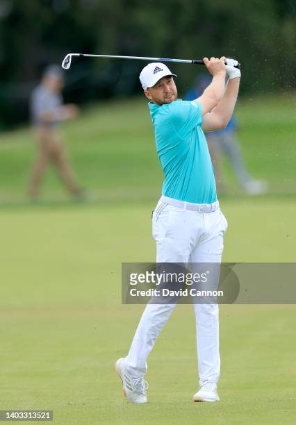Daniel Berger of The United States plays his second shot on the 18th hole during the first round of the 2022 U.S.Open Championship at The Country...