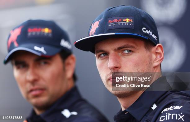 Max Verstappen of the Netherlands and Oracle Red Bull Racing and Sergio Perez of Mexico and Oracle Red Bull Racing look on in the Paddock during...