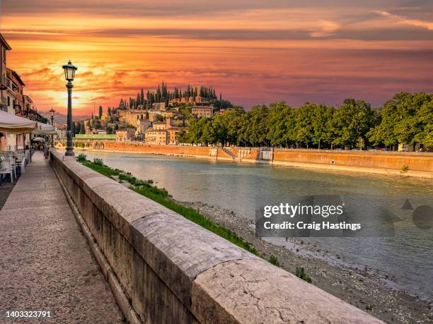 castel san pietro river adige scene at sunset in verona italy - verona italy stock pictures, royalty-free photos & images