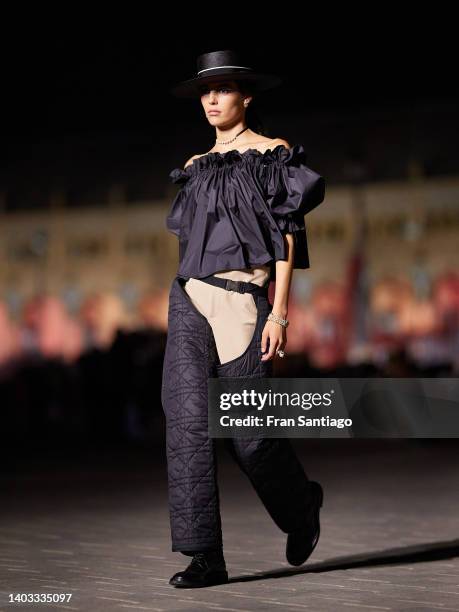 Model walks the runway during the Dior "Crucero Collection" fashion show by Christian Dior at Plaza de España on June 16, 2022 in Seville, Spain.