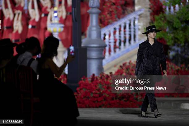 Model parades a dress from the Cruise 2023 collection of French fashion house Dior at the Plaza de España, on June 16 in Seville .