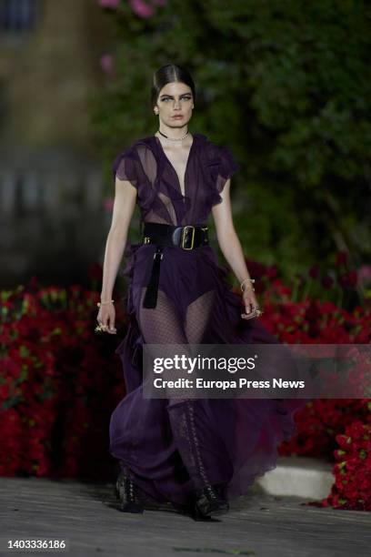 Model parades a dress from the Cruise 2023 collection of French fashion house Dior at the Plaza de España, on June 16 in Seville .