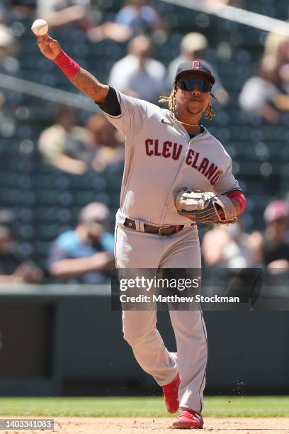 Jose Ramirez of the Cleveland Guardians throws out Randal Grichuk of the Colorado Rockies in the fourth inning at Coors Field on June 16, 2022 in...