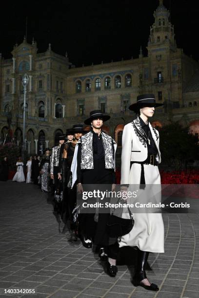 Models walk the runway during the Dior "Crucero Collection" fashion show by Christian Dior at Plaza de España on June 16, 2022 in Seville, Spain.