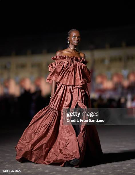 Model walks the runway during the Dior "Crucero Collection" fashion show by Christian Dior at Plaza de España on June 16, 2022 in Seville, Spain.