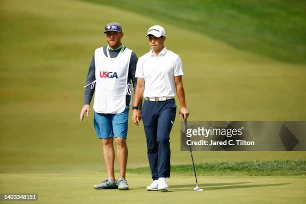 Amateur Keita Nakajima of Japan waits with his caddie William Harke on the ninth green during round one of the 122nd U.S. Open Championship at The...