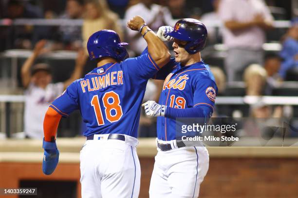 Mark Canha of the New York Mets celebrates his two-run home run with Nick Plummer in the fifth inning against the Milwaukee Brewers at Citi Field on...