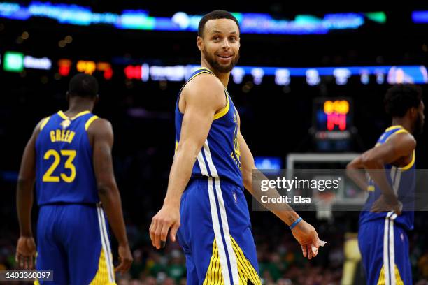 Stephen Curry of the Golden State Warriors reacts against the Boston Celtics during the first quarter in Game Six of the 2022 NBA Finals at TD Garden...