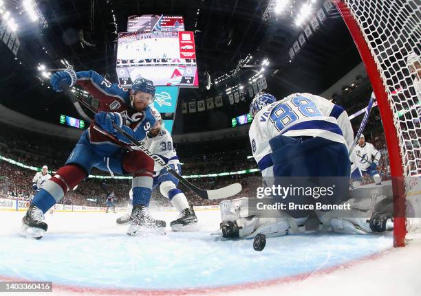 Gabriel Landeskog of the Colorado Avalanche scores a goal against Andrei Vasilevskiy of the Tampa Bay Lightning during the first period in Game One...