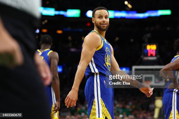 Stephen Curry of the Golden State Warriors reacts against the Boston Celtics during the first quarter in Game Six of the 2022 NBA Finals at TD Garden...