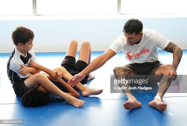 Featherweight Andre Fili instructs children during a seminar in cooperation with the UFC and We Defy Foundation at the Renzo Gracie Austin jiu jitsu...