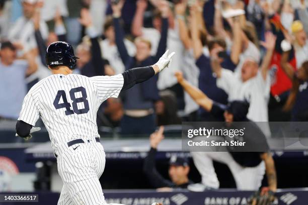 Anthony Rizzo of the New York Yankees reacts after hitting a walk-off home run during the ninth inning against the Tampa Bay Rays at Yankee Stadium...