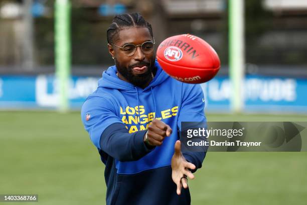 Rams player Nick Scott handballs a Sherrin Football during a Richmond Tigers AFL media opportunity at Punt Road Oval on June 17, 2022 in Melbourne,...