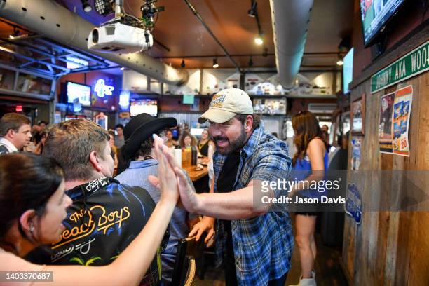 Rodney Atkins of Rod + Rose greets campers as they sing on stage at Winners Bar on June 15, 2022 in Nashville, Tennessee.