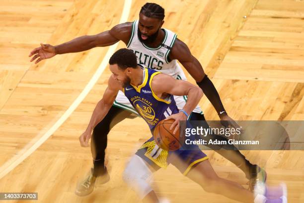 Stephen Curry of the Golden State Warriors drives to the basket against Jaylen Brown of the Boston Celtics \din Game Six of the 2022 NBA Finals at TD...