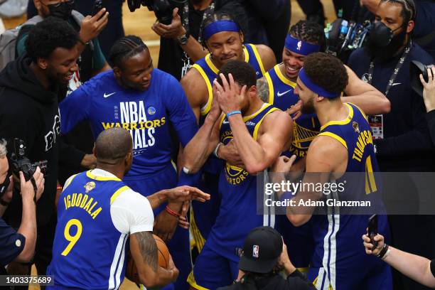 Stephen Curry of the Golden State Warriors celebrates with teammates after defeating the Boston Celtics 103-90 in Game Six of the 2022 NBA Finals at...