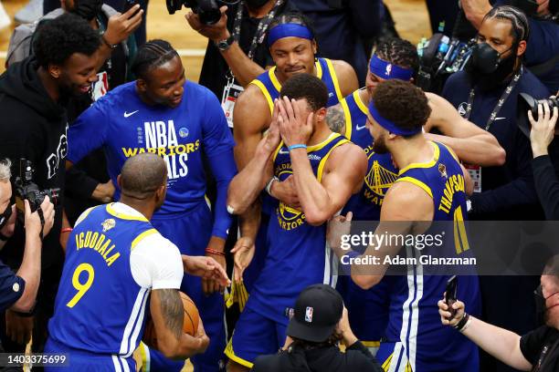 Stephen Curry of the Golden State Warriors celebrates with teammates after defeating the Boston Celtics 103-90 in Game Six of the 2022 NBA Finals at...