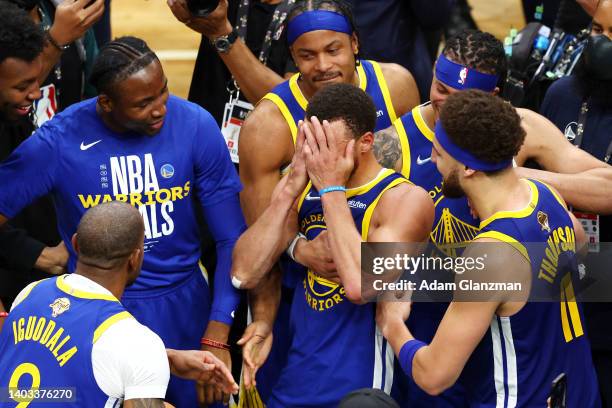 Stephen Curry of the Golden State Warriors celebrates with teammates after defeating the Boston Celtics 103-90 in Game Six of the 2022 NBA Finals at...