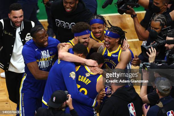 The Golden State Warriors celebrate after defeating the Boston Celtics 103-90 in Game Six of the 2022 NBA Finals at TD Garden on June 16, 2022 in...