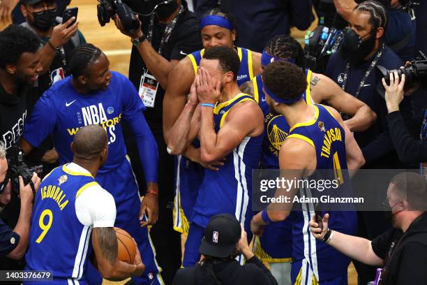 Stephen Curry of the Golden State Warriors celebrates with teammates after defeating the Boston Celtics 103-90 in Game Six of the 2022 NBA Finals at...