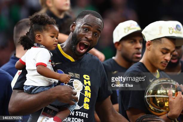 Draymond Green celebrates with his daughter Cash Green after defeating the Boston Celtics 103-90 in Game Six of the 2022 NBA Finals at TD Garden on...
