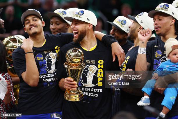 Stephen Curry of the Golden State Warriors adn Jordan Poole after defeating the Boston Celtics 103-90 in Game Six of the 2022 NBA Finals at TD Garden...