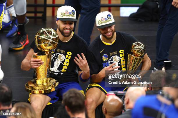 Klay Thompson and Stephen Curry of the Golden State Warriors pose for a photo after defeating the Boston Celtics 103-90 in Game Six of the 2022 NBA...