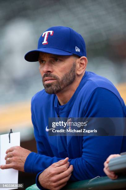 Manager Chris Woodward of the Texas Rangers in the dugout during the game against the Oakland Athletics at RingCentral Coliseum on May 26, 2022 in...