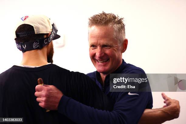 Stephen Curry of the Golden State Warriors celebrates with head coach Steve Kerr after defeating the Boston Celtics 103-90 in Game Six to win the...