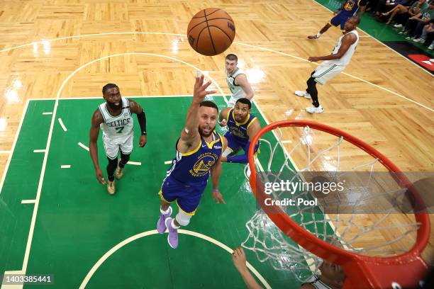 Stephen Curry of the Golden State Warriors goes up for a layup against the Boston Celtics in Game Six of the 2022 NBA Finals at TD Garden on June 16,...