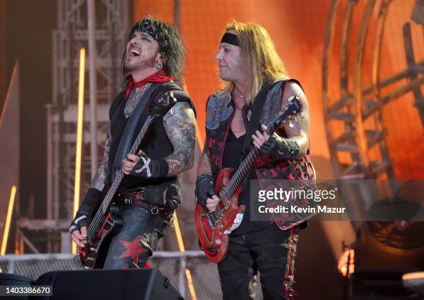 Nikki Sixx and Vince Neil of Mötley Crüe perform onstage during The Stadium Tour at Truist Park on June 16, 2022 in Atlanta, Georgia.