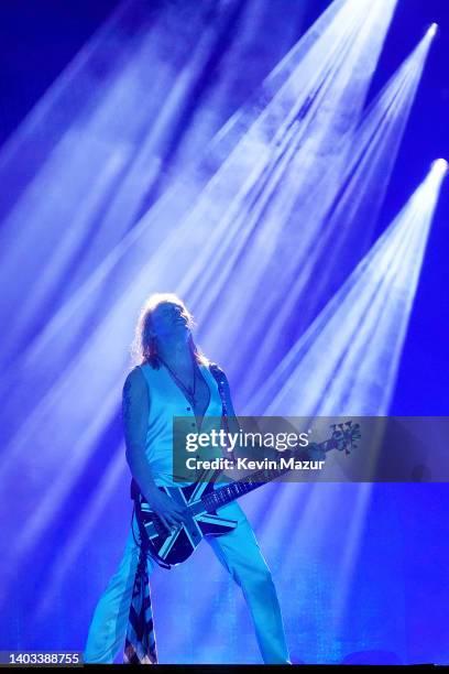 Rick Savage of Def Leppard performs onstage during The Stadium Tour at Truist Park on June 16, 2022 in Atlanta, Georgia.