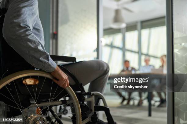 unrecognizable candidate in a wheelchair entering on a job interview. - disability employment stock pictures, royalty-free photos & images