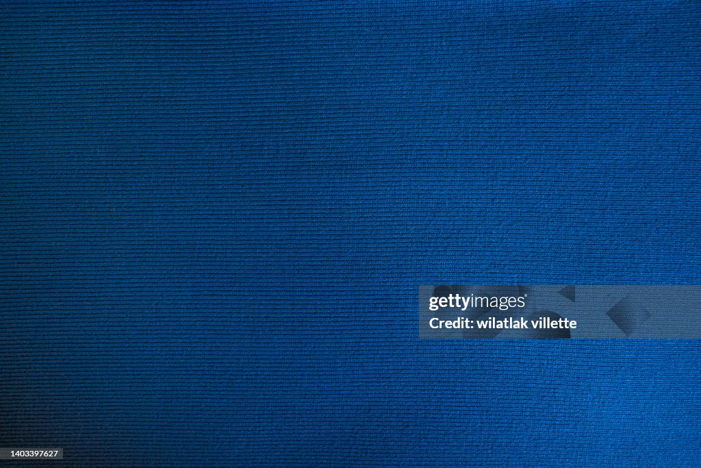 Dark blue fabric cloth polyester texture and textile background.