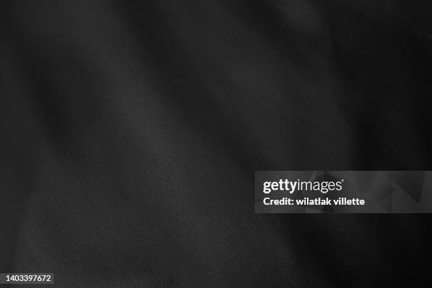 black background. - obsidian stock pictures, royalty-free photos & images