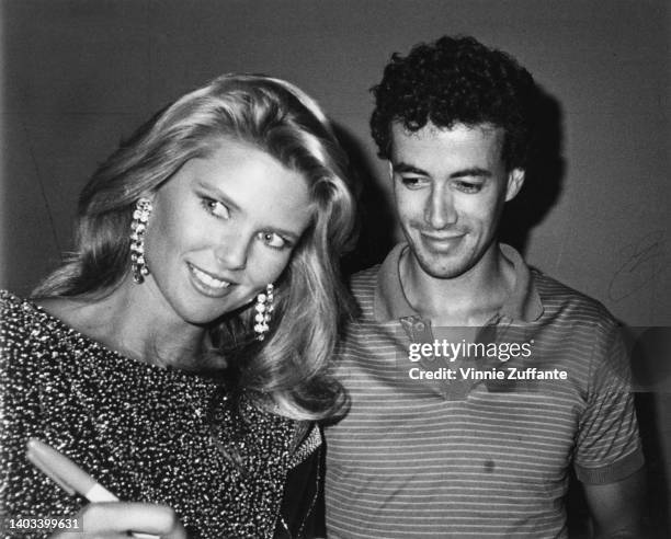 American fashion model Christie Brinkley and French racing driver Olivier Chandon de Brailles attend the 'Faces of the 80s' contest, held at the...