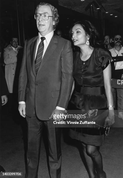 British actor Michael Caine and wife, Guyanese actress and fashion model Shakira Caine, attend the premiere of 'The Fourth Protocol,' held at the...