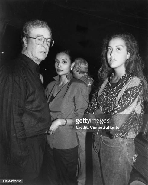 British actor Michael Caine, his wife, Guyanese actress and fashion model Shakira Caine, and their daughter Natasha attend the New York premiere of...