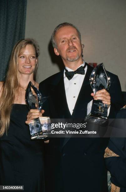 American actress Suzy Amis and Canadian film director and screenwriter James Cameron attend the 25th People's Choice Awards, held at the Pasadena...